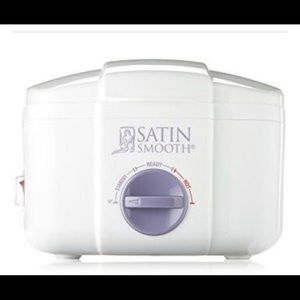 Wax warmer with unopened pink cream wax